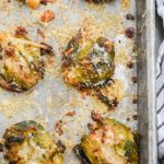 Overhead photo of smashed brussels sprouts on baking dish.