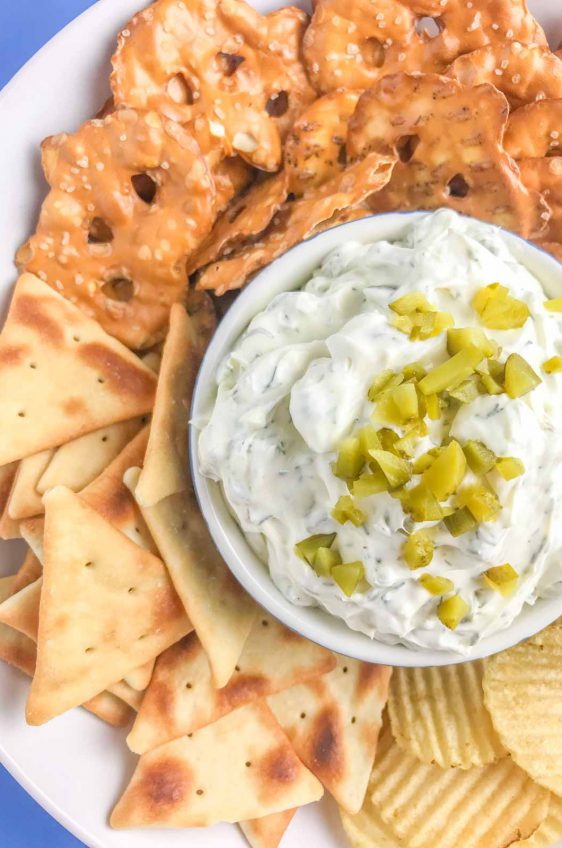 Creamy Dill Pickle Dip is going to be THE dip you'll want to bring to all your summer potlucks. It is super easy to make and a crowd pleaser! 