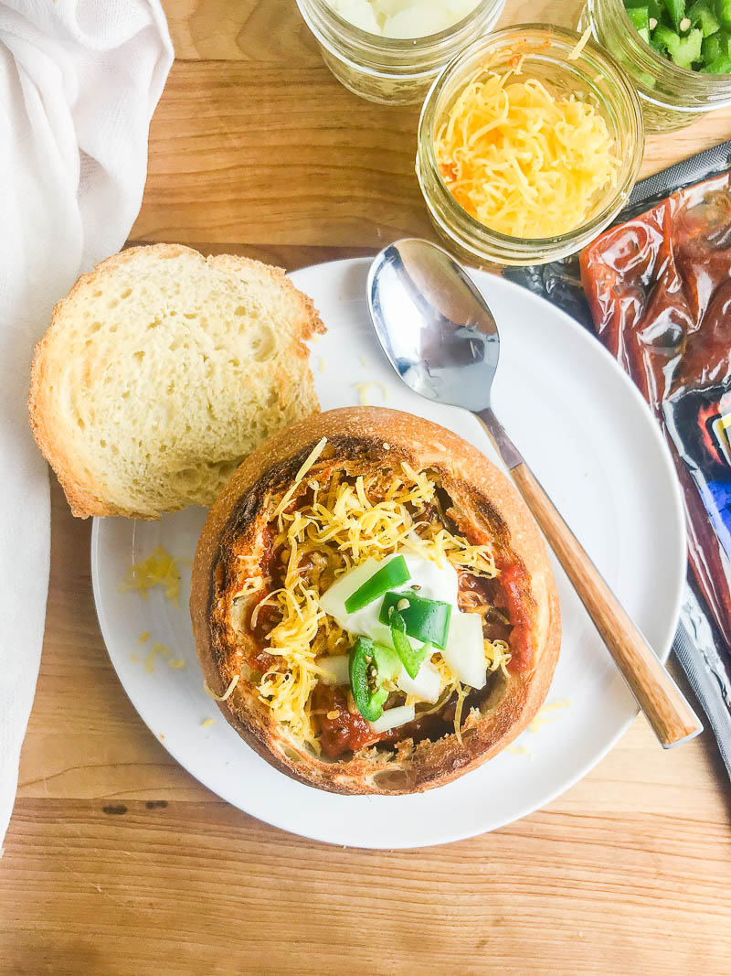 BBQ Rib Chili Bread Bowls, with all of your favorite toppings, are a hearty meal to serve on cool days. They are a must for game day parties too! 